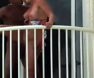 caught an multiracial duo on the balcony